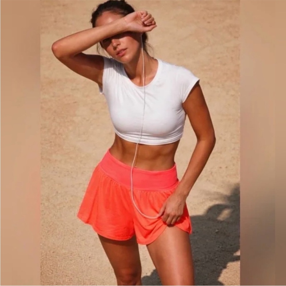 FP Movement Tempo Light As Air UV Protection Run Shorts in Neon Orange